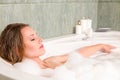 Young beautiful woman in a bath Royalty Free Stock Photo