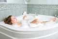 Young beautiful woman in a bath Royalty Free Stock Photo