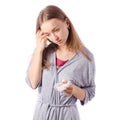 Young beautiful woman in a bathrobe has a headache cold flu napkin Royalty Free Stock Photo