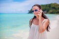 Young beautiful woman at beach talking by her phone Royalty Free Stock Photo