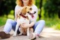 Young beautiful woman with Beagle dog in the park Royalty Free Stock Photo