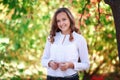 Young beautiful woman. Beauty smiling teenager girl in autumn park Royalty Free Stock Photo