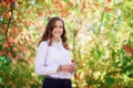 Young beautiful woman. Beauty smiling teenager girl in autumn park Royalty Free Stock Photo