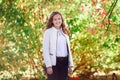 Young beautiful woman. Beauty smiling teenager girl in autumn park Royalty Free Stock Photo