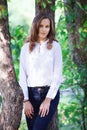 Young beautiful woman. Beauty smiling teenager girl in autumn park Royalty Free Stock Photo