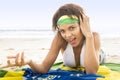 Young beautiful woman in bikini on beach with Brazil flag Royalty Free Stock Photo