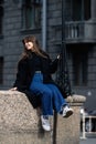 A young beautiful woman in a black coat Royalty Free Stock Photo