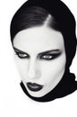 Young beautiful woman in black with gothic fashion makeup , posi