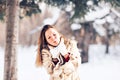 Young beautiful woman blowing snow in winter Royalty Free Stock Photo