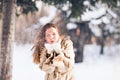 Young beautiful woman blowing snow in winter Royalty Free Stock Photo