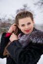 A young beautiful woman braids her hair Royalty Free Stock Photo