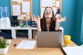 Young beautiful woman business worker doing yoga exercise at office Royalty Free Stock Photo