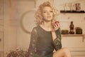 Young beautiful woman in a cafe. Modern trendy blondy girl in re