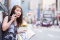 Young beautiful woman calling public taxi by phone Royalty Free Stock Photo