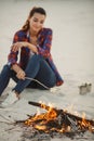 Woman Camping Near Campfire Royalty Free Stock Photo