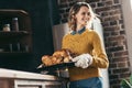 young beautiful woman carrying tray with delicious turkey