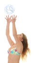 Young beautiful woman catching a beach ball Royalty Free Stock Photo