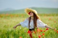 Young beautiful woman on cereal field with poppies in summer Royalty Free Stock Photo