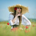 Young beautiful woman on cereal field in summer Royalty Free Stock Photo