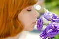 Young beautiful woman & chinese rose outdoors Royalty Free Stock Photo