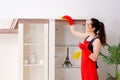 The young beautiful woman cleaning apartment Royalty Free Stock Photo