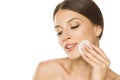 Young beautiful woman cleaning her face with cotton pad Royalty Free Stock Photo