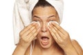 Young beautiful woman cleaning her face with cotton pads Royalty Free Stock Photo