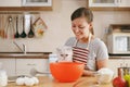 Young beautiful woman is cooking in the kitchen. Royalty Free Stock Photo