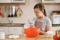 Young beautiful woman is cooking in the kitchen. Royalty Free Stock Photo