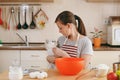 Young beautiful woman is cooking in the kitchen. Royalty Free Stock Photo