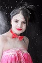 Young beautiful woman covered with a white powder Royalty Free Stock Photo