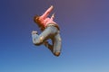 Young beautiful woman dancer jumping