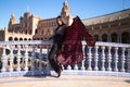 Young and beautiful woman dancing flamenco and Spanish posing in urban clothes, wearing her hair loose and long and standing on