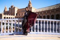 Young and beautiful woman dancing flamenco and Spanish posing in urban clothes, wearing her hair loose and long and standing on Royalty Free Stock Photo