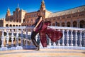 Young and beautiful woman dancing flamenco and Spanish posing in urban clothes, wearing her hair loose and long and standing on Royalty Free Stock Photo