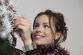 Young beautiful woman decorating Christmas tree Royalty Free Stock Photo