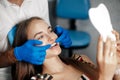 Young beautiful woman at the dental clinic at the doctorÃ¢â¬â¢s appointment