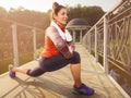 Young beautiful woman doing fitness in a park. Royalty Free Stock Photo