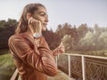 Young beautiful woman doing fitness in a park. Royalty Free Stock Photo