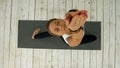Young beautiful woman doing yoga exercise, sun salutation pose Royalty Free Stock Photo