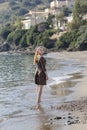 Young girl standing on the beach close-up Royalty Free Stock Photo