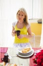 Young beautiful woman is drinking coffee