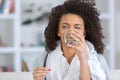 Young beautiful woman drinks water from glass Royalty Free Stock Photo