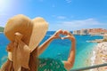 Young beautiful woman in Dubrovnik making hands shaped heart on spring summer warm sunny day. Girl with hat happy outdoors in her Royalty Free Stock Photo