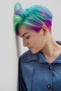 Young beautiful woman with dyed blue and green hair. Pixie bob short haircut The concept of hair styling.