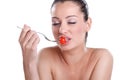 Young beautiful woman eating fresh Cherry tomatoes Royalty Free Stock Photo