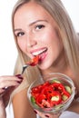 Young beautiful woman eats vegetable salad. Healthy eating. To be in shape. Royalty Free Stock Photo