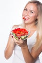 Young beautiful woman eats vegetable salad. Healthy eating. To be in shape. Royalty Free Stock Photo