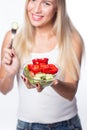 Young beautiful woman eats vegetable salad. Healthy eating. To be in shape. Royalty Free Stock Photo