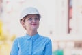 The young beautiful woman engineer oversees construction